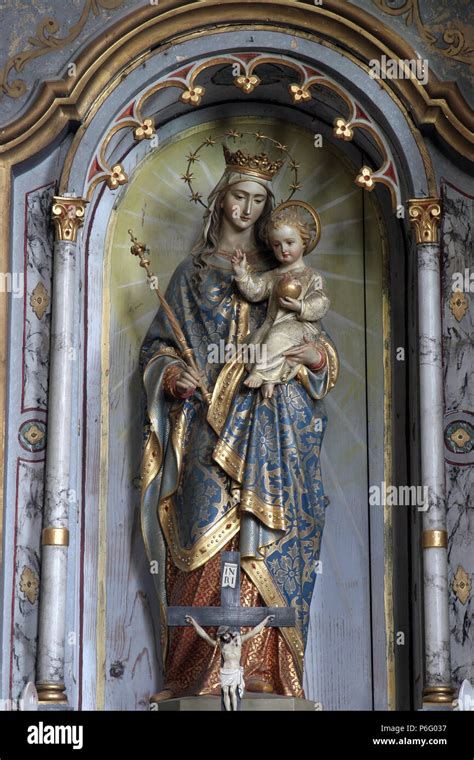 Virgin Mary with baby Jesus, statue on the altar in Saint Eliah church ...