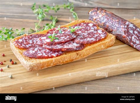 Sandwich Wit Braunschweiger Sausage On The Wodden Cutting Board Stock