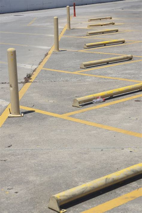 Parking Barriers and Poles, Yellow Parking Markings. Close-up of ...