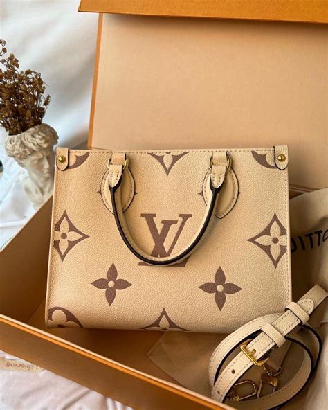 Louis Vuitton Onthego Pm Bicolor Cream Luxury Bags Wallets On Carousell