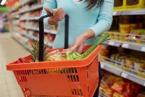 Woman With Food Basket At Grocery Or Supermarket Stock Photo Image Of