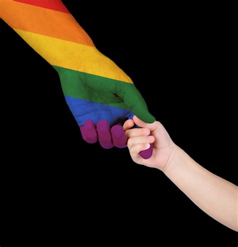 Adult And Child Holding Hands Patterned As The Rainbow Flag