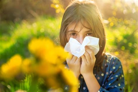 Premium Photo | Child girl allergic to flowers selective focus