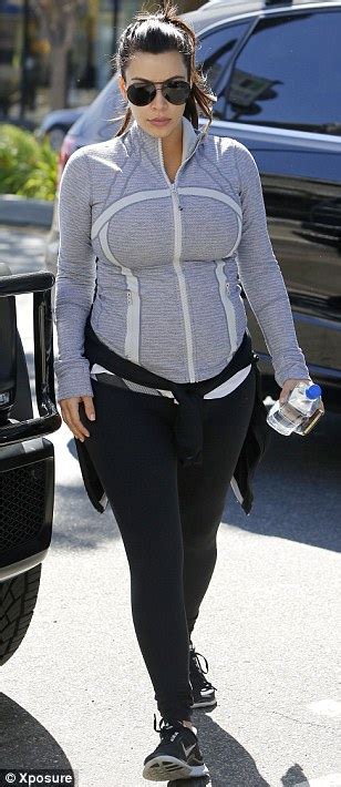 Kim Kardashian Keeps Her Pregnancy Curves Under Wraps As She Heads To