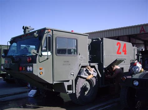 Usmc Firefighters Maintain Their Oshkosh P 19 Arff Vehicle Flickr