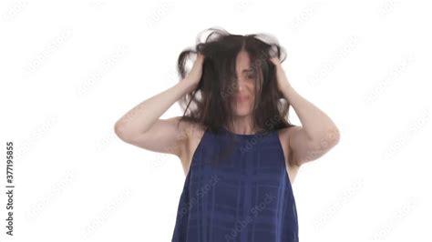 Caucasian woman suffering from itching and scratching her head. Lice ...