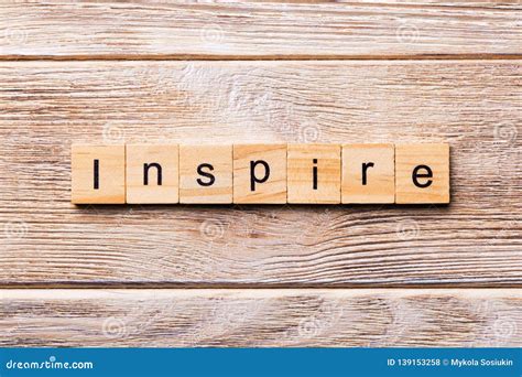 Inspire Word Written On Wood Block Inspire Text On Wooden Table For