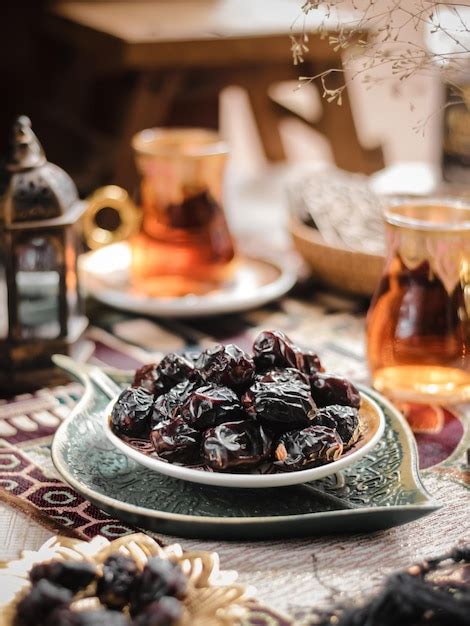 Premium Photo Kurma Ajwa Or Ajwa Dates Fruits On The Table One Of