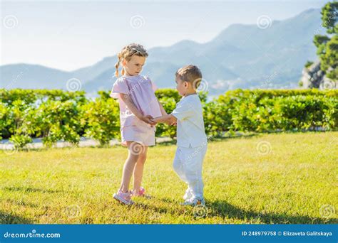 Portrait Of Two Cute Adorable Baby Children Toddlers Hugging And