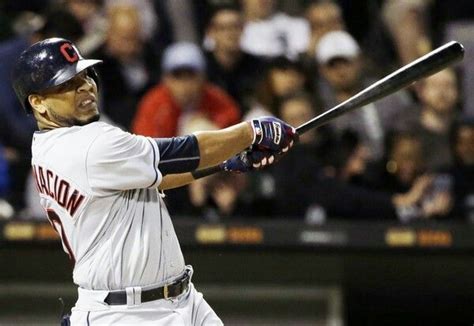 Cleveland Indians' Edwin Encarnacion hits a single against the Chicago ...