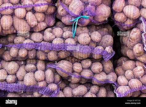 The background of potatoes in mesh bags Stock Photo - Alamy