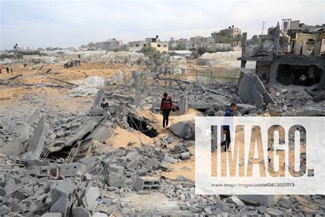 240212 GAZA Feb 12 2024 Palestinians Check The Rubble Of A