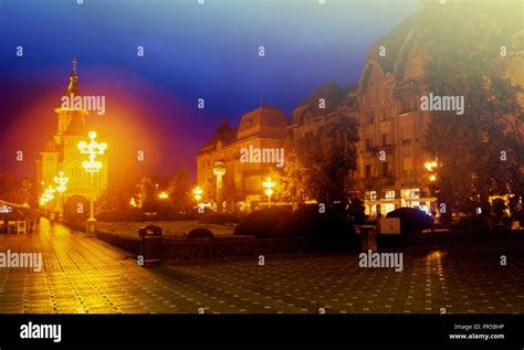 Night View Of Victoriei Square On Background With Romanian Orthodox