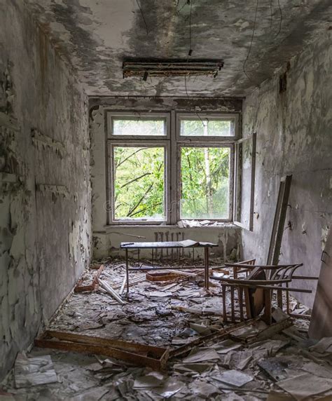 Abandoned School Study With Debris And Broken Furniture Stock Image