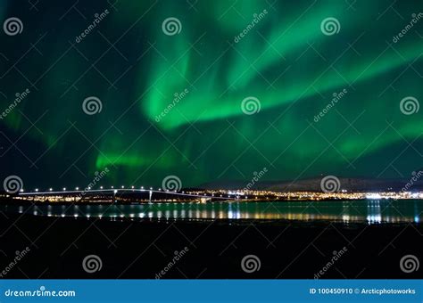 Aurora Borealis Over Tromso City Island, Fjord and Snowy Mountain Stock ...