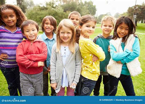 Group Of Young Children Hanging Out In Park Stock Image Image Of