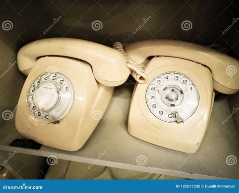 White Cream Vintage Rotary Desk Telephone In Aged Tone Photo Stock