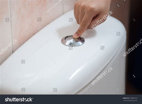 hand push flush button stock photo edit