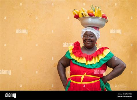 Happy Smiling Palenquera Fresh Fruit Street Vendor In The Old Town Of