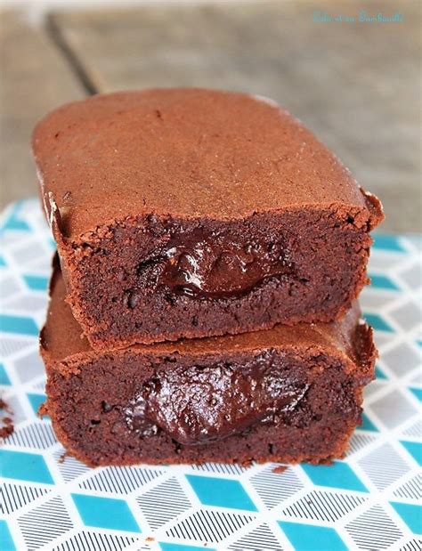 Two Chocolate Brownies Stacked On Top Of Each Other