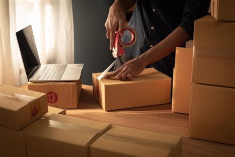 Premium Photo Man Preparing A Parcel For Delivery At Online Selling