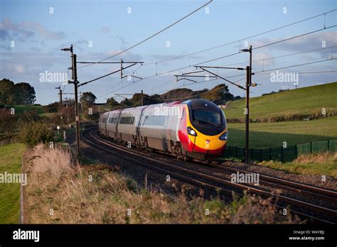 Virgin trains pendolino train tilting round a curve on the west coast ...