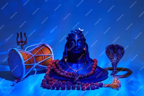 Premium Photo | Shivaratri background with shivas trident pellet drum ...