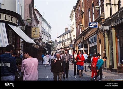 Shoppers Walking Along Pedestrianised London Street Norwich Norfolk