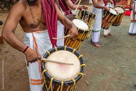 Indian Men Play Traditional Percussion Drum Chenda In Kerala India