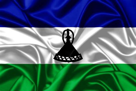 El Reino De Lesotho Ondeando La Bandera De Cerca Con Fondo De Textura