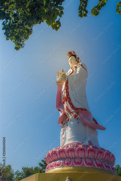 Giant White Guanyin Statue With Blue Sky Background Guanyin Or Guan