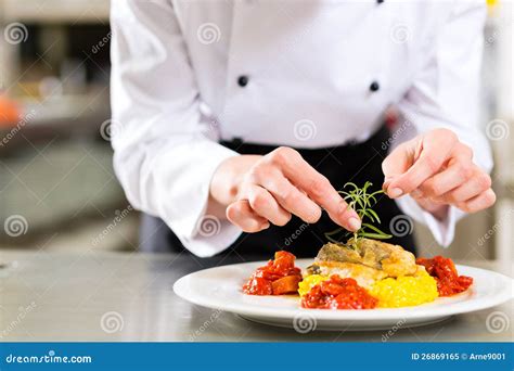 Female Chef In Restaurant Kitchen Cooking Stock Image Image Of