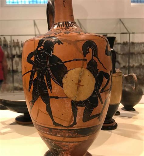 an old vase with two men on it