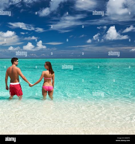 Couple on a beach at Maldives Stock Photo - Alamy