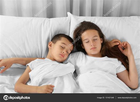 Brother Sister Sleeping Bed Stock Photo by ©belchonock 131421348