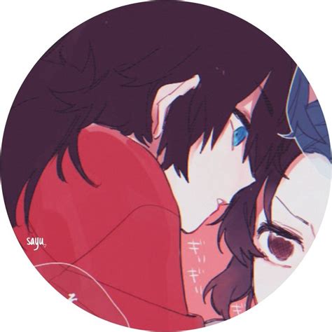 Two Anime Characters Hugging Each Other In Front Of A White Circle With