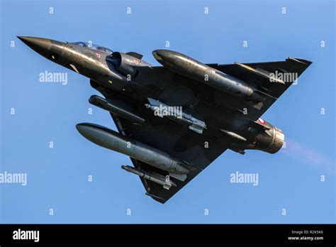 Armed delta wing fighter jet plane in flight Stock Photo - Alamy