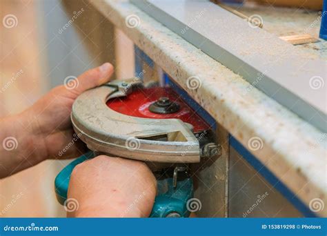 Carpenter Using Circular Saw Cutting Cut Hole In Kitchen Furniture