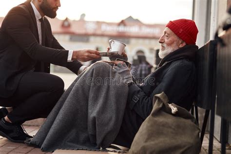 Merciful Rich Man In Suit Help Homeless Man Stock Photo Image Of