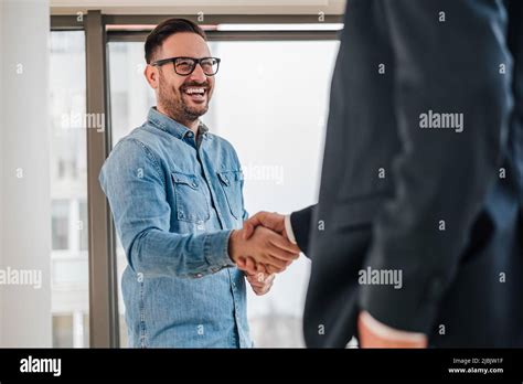 Happy Business Partners Shaking Hands In Meeting Entrepreneurs