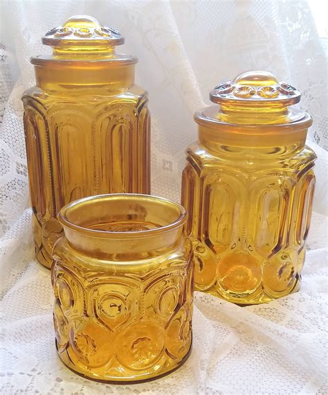 Choice Vintage Moon And Stars Amber Canisters And Lids By L E Smith