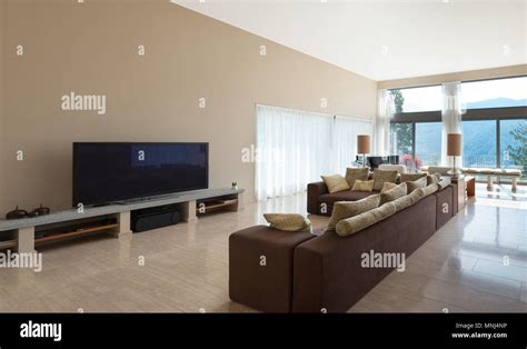 Interior of a modern living room, comfortable divan Stock Photo - Alamy