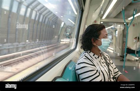 Woman Commuter Wearing Face Mask Inside Subway Train Travel New Normal