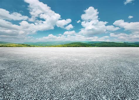 Asphalt Road And Green Mountain Nature Landscape Under Blue Sky With