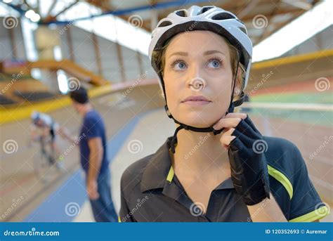 Female Cyclist Securing Helmet Stock Image - Image of training, fasten ...