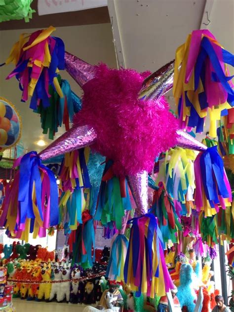 Colorful Streamers Hanging From The Ceiling In A Store