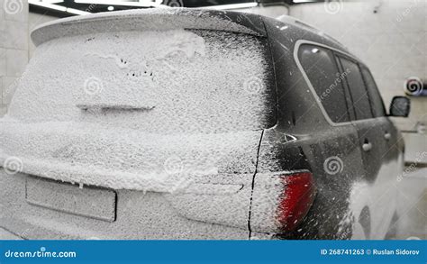 Luxury Car Covered in Foam at a Car Wash. Closeup Car Wash with High ...