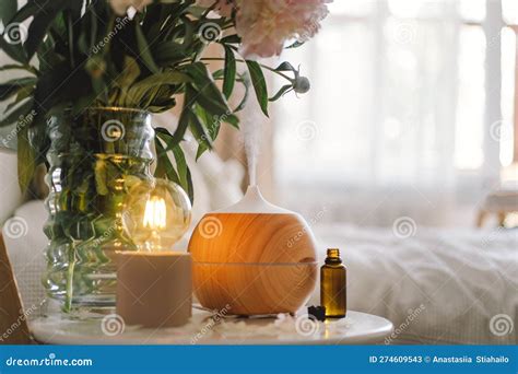 Aroma Oil Diffuser On Chair Against In The Bedroom Air Freshener Stock