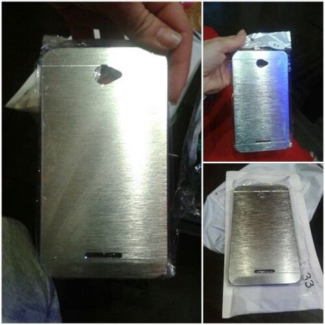 Three Pictures Of The Back Side Of A Silver Cell Phone