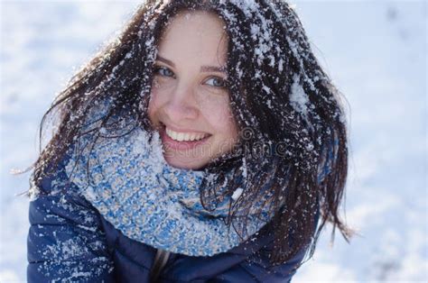 Portrait Of A Beautiful Smiling Girl With Snow In Her Hair Stock Image